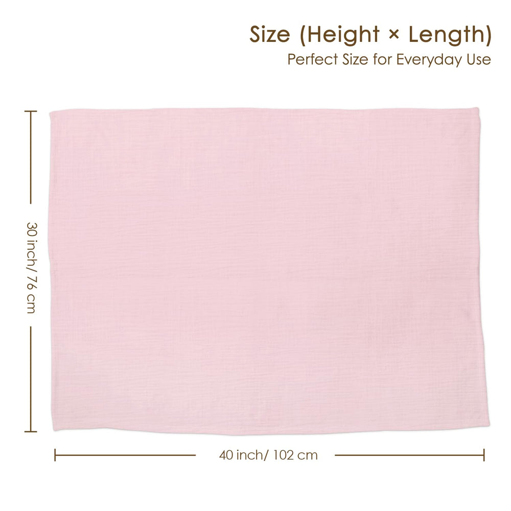 SANDJEST baby blanket in a crib setting with soft pink tones