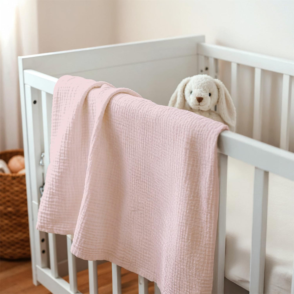 Nursing moment with SANDJEST pink blanket providing light coverage