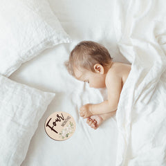 Sanyakti nine-month milestone card documents curiosity during playtime photos.