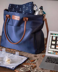 Sarah Wells Abby leather straps highlight premium hardware for a professional look