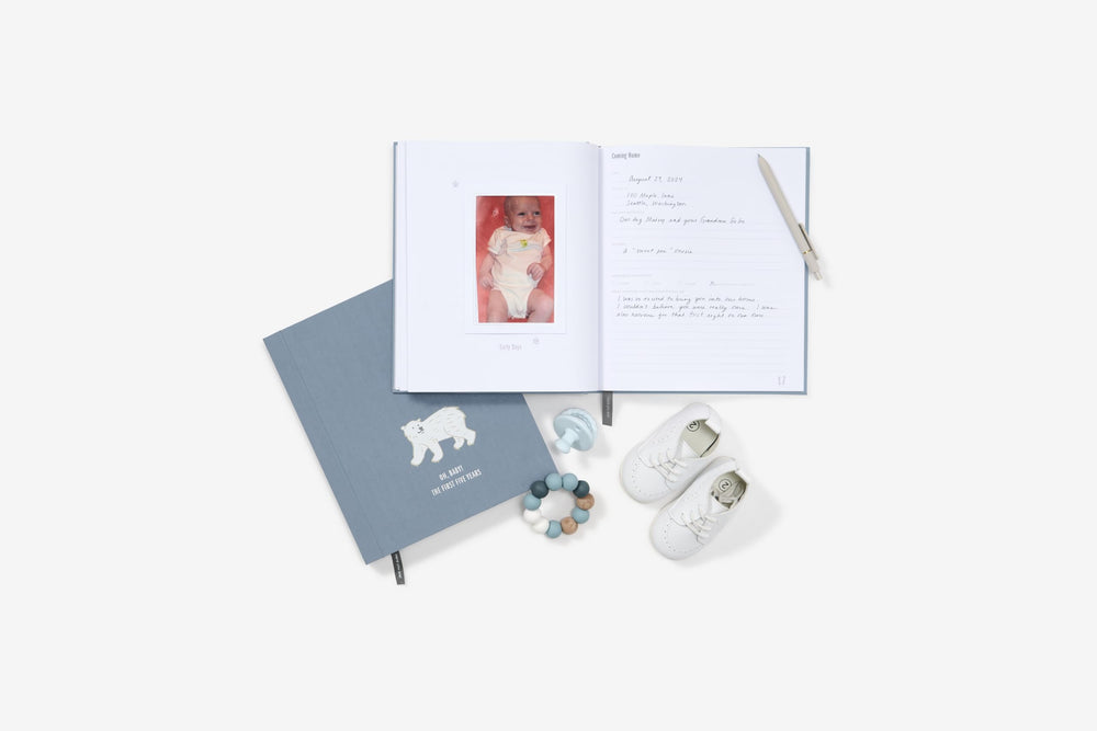 Savor baby memory book photo pages highlighting milestones.