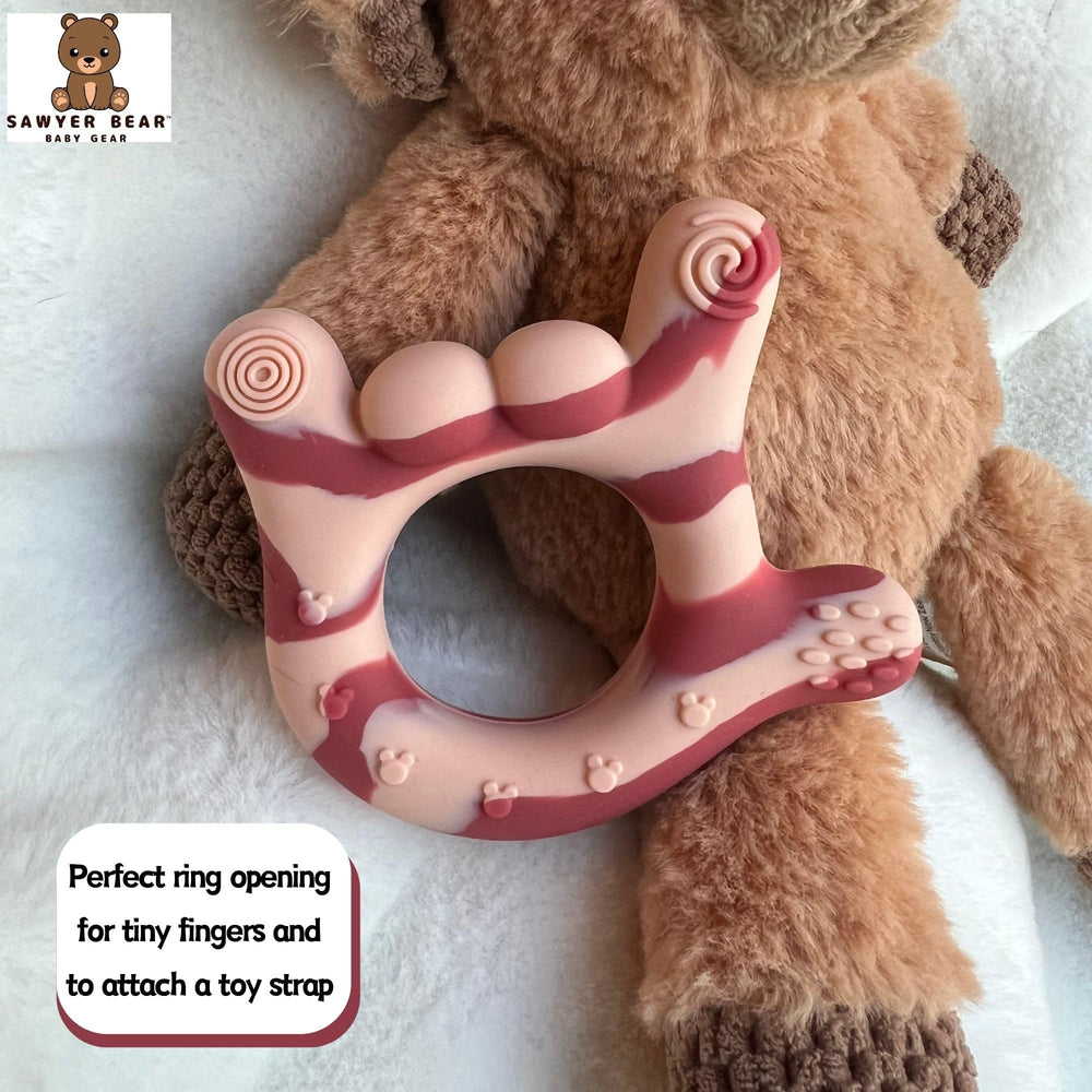 SAWYER BEAR teether freezer-friendly for cool comfort on sore gums.