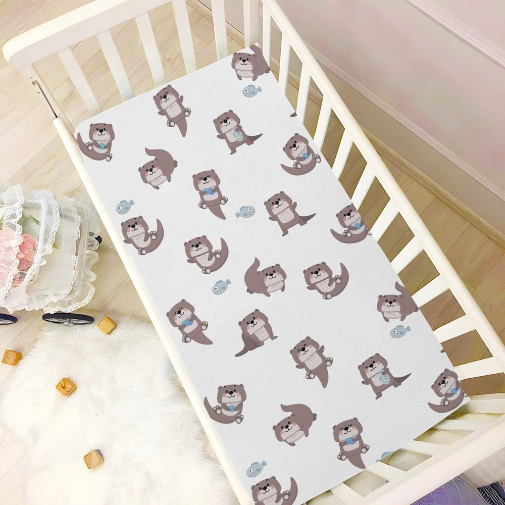 SDMKA otter nursery decor motif complements crib sheets beautifully.