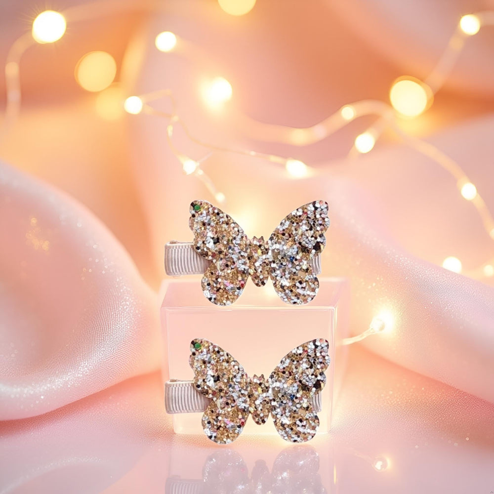 Seadiquiet glitter gold butterfly bow clip adds a playful sparkle finish.
