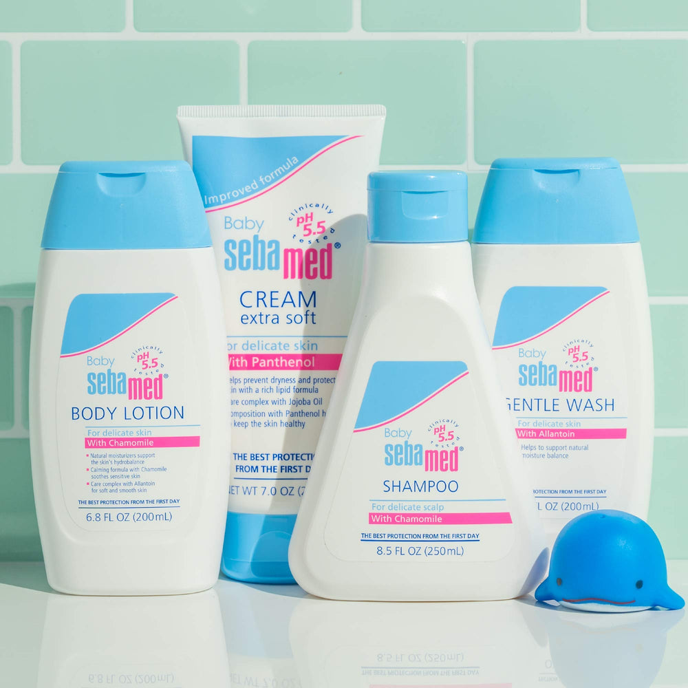Baby-friendly skincare routine with SEBAMED cream on clean face after bath.