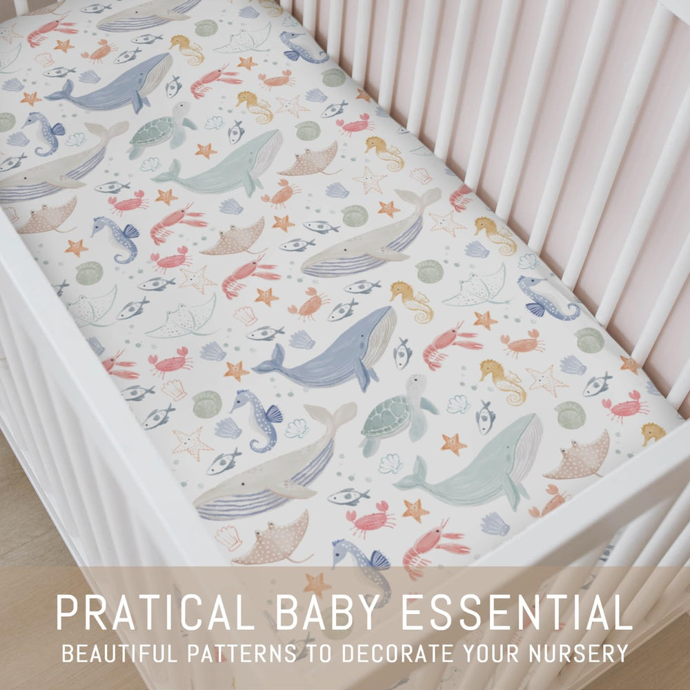 Selgkds Boho Ocean Animals Shells Crib Sheet adds ocean charm.