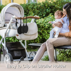 Seposeve silicone pacifier holder case in outdoor use with baby items inside.