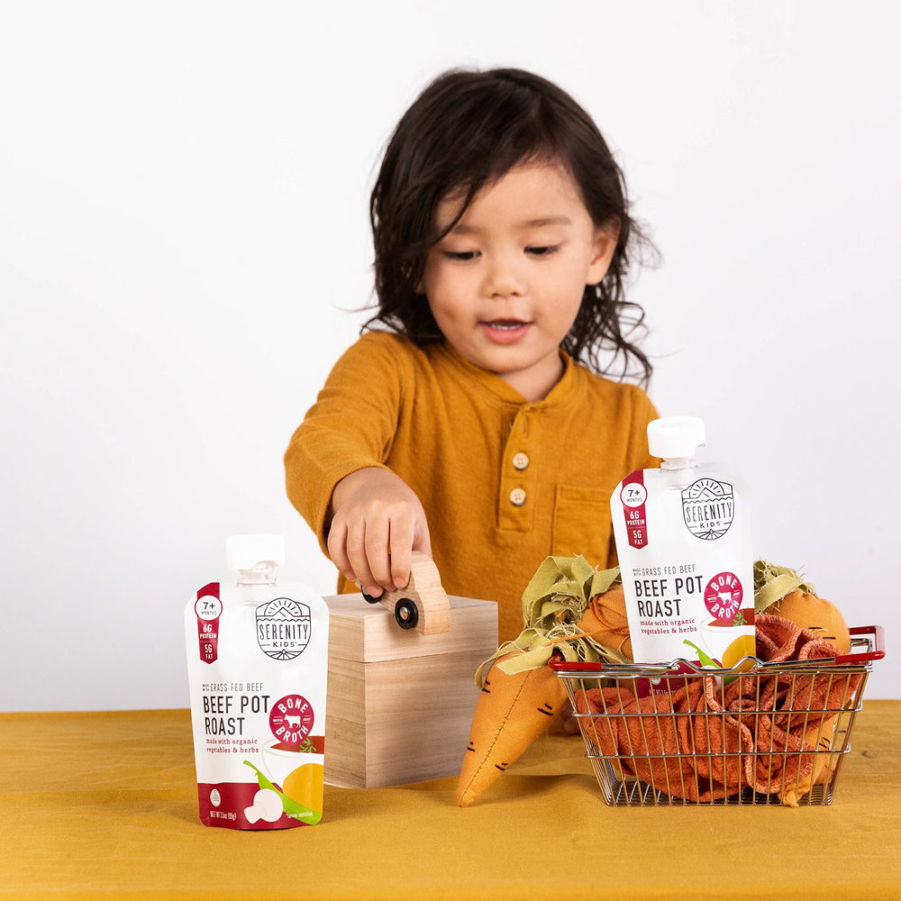 Serenity Kids pouch being squeezed for on-the-go feeding during a busy day.