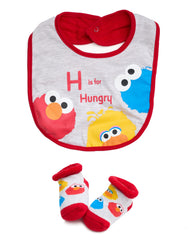 Sesame Street bib featuring Elmo and Cookie Monster protects outfits during meals.