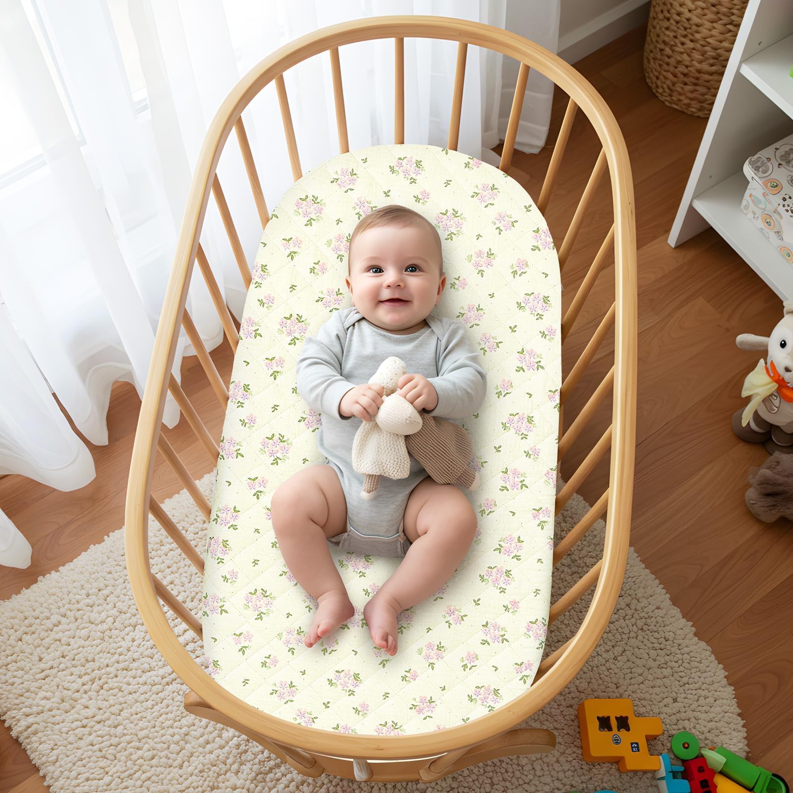 SheSeek Sheets in pink with oval cradle fit for curved bassinet edges.