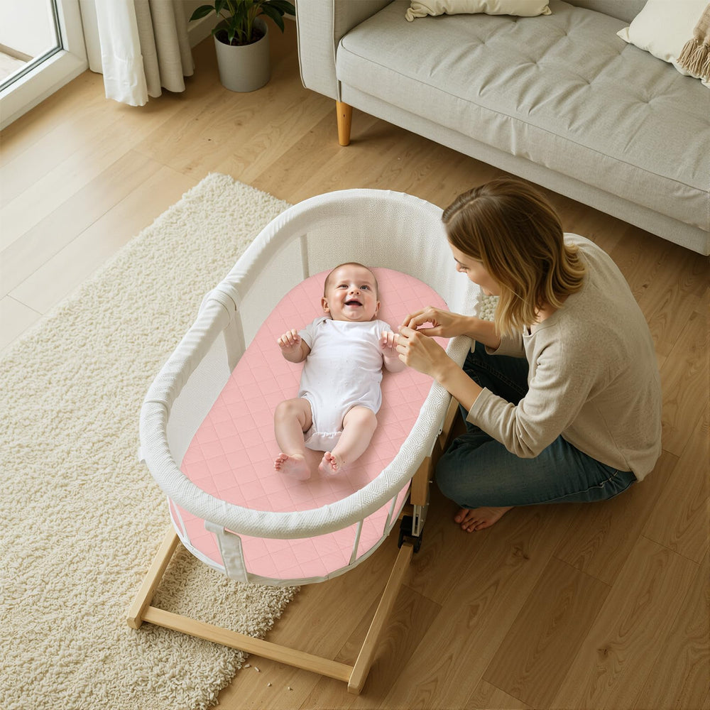 Pink finish SheSeek bassinet sheet highlighting cozy, breathable comfort.