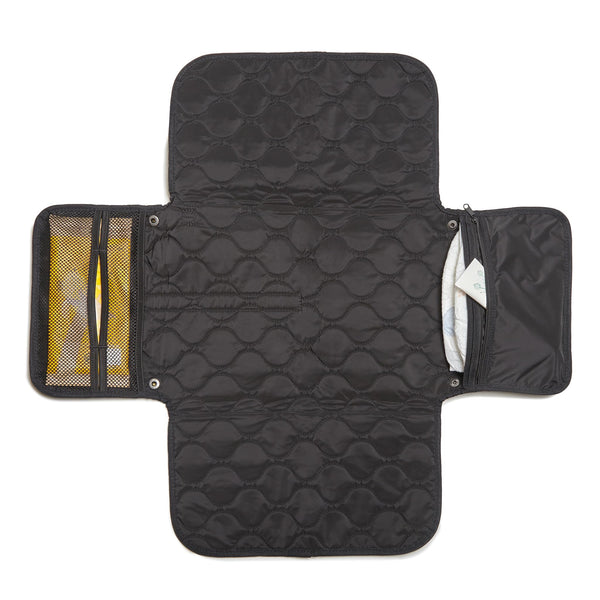 shorty-love quilted changing pad folded for compact travel.