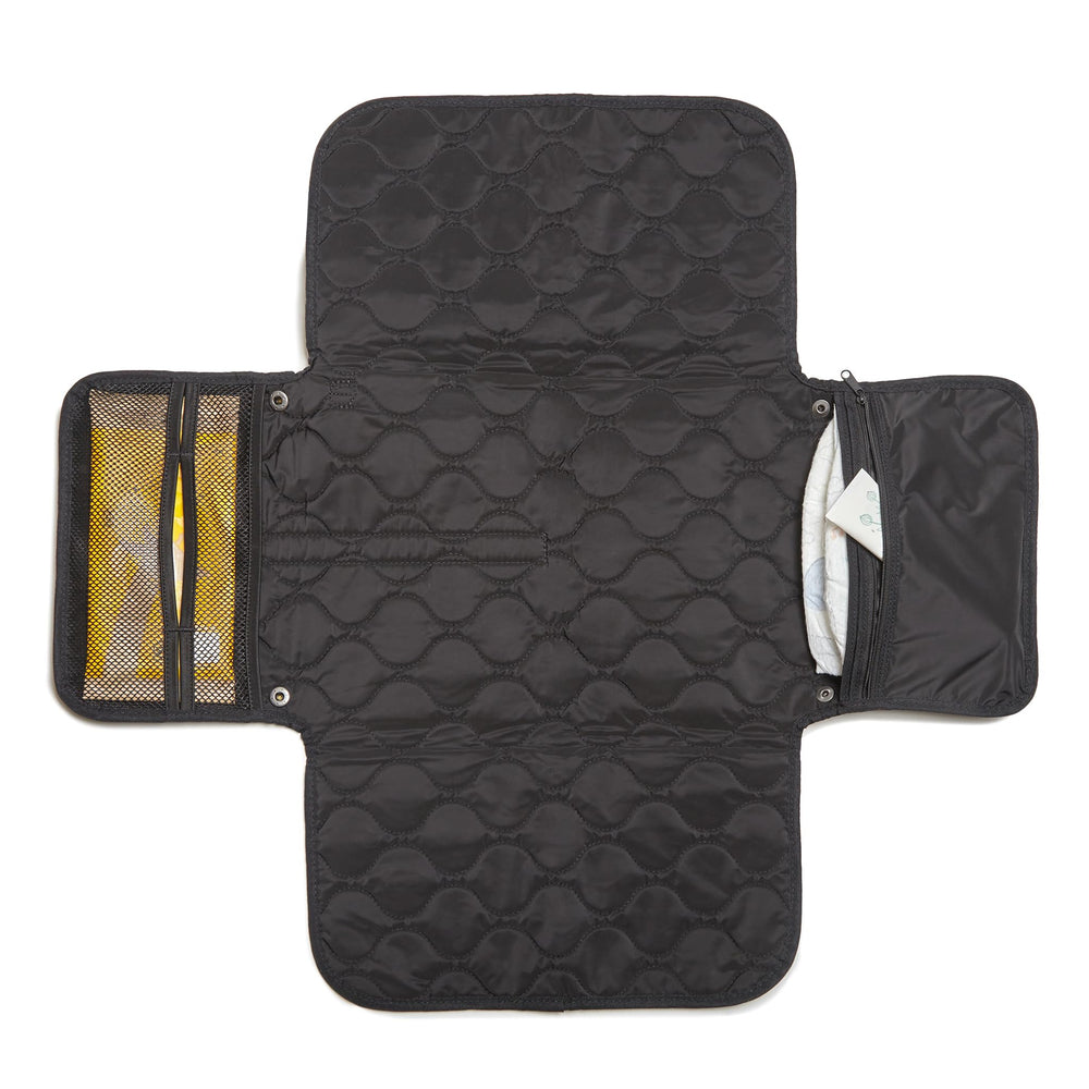 shorty-love quilted changing pad folded for compact travel.
