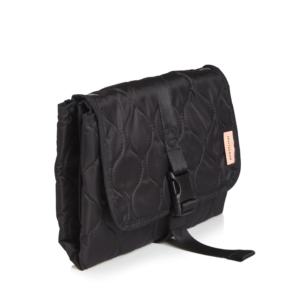 shorty-love changing pad with wings open showing expanded storage.