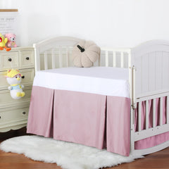 Shunjie.Home pink dust ruffle decorates crib with gentle charm.