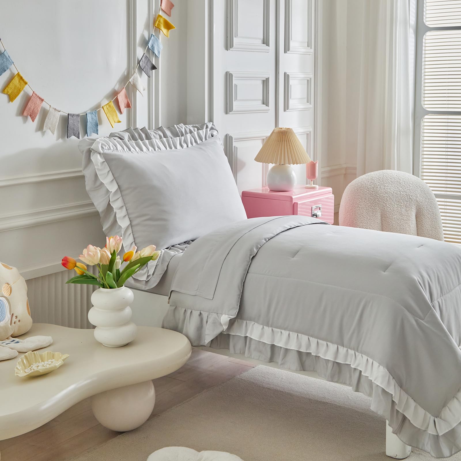 Shxime light grey fitted sheet showing a snug toddler bed fit