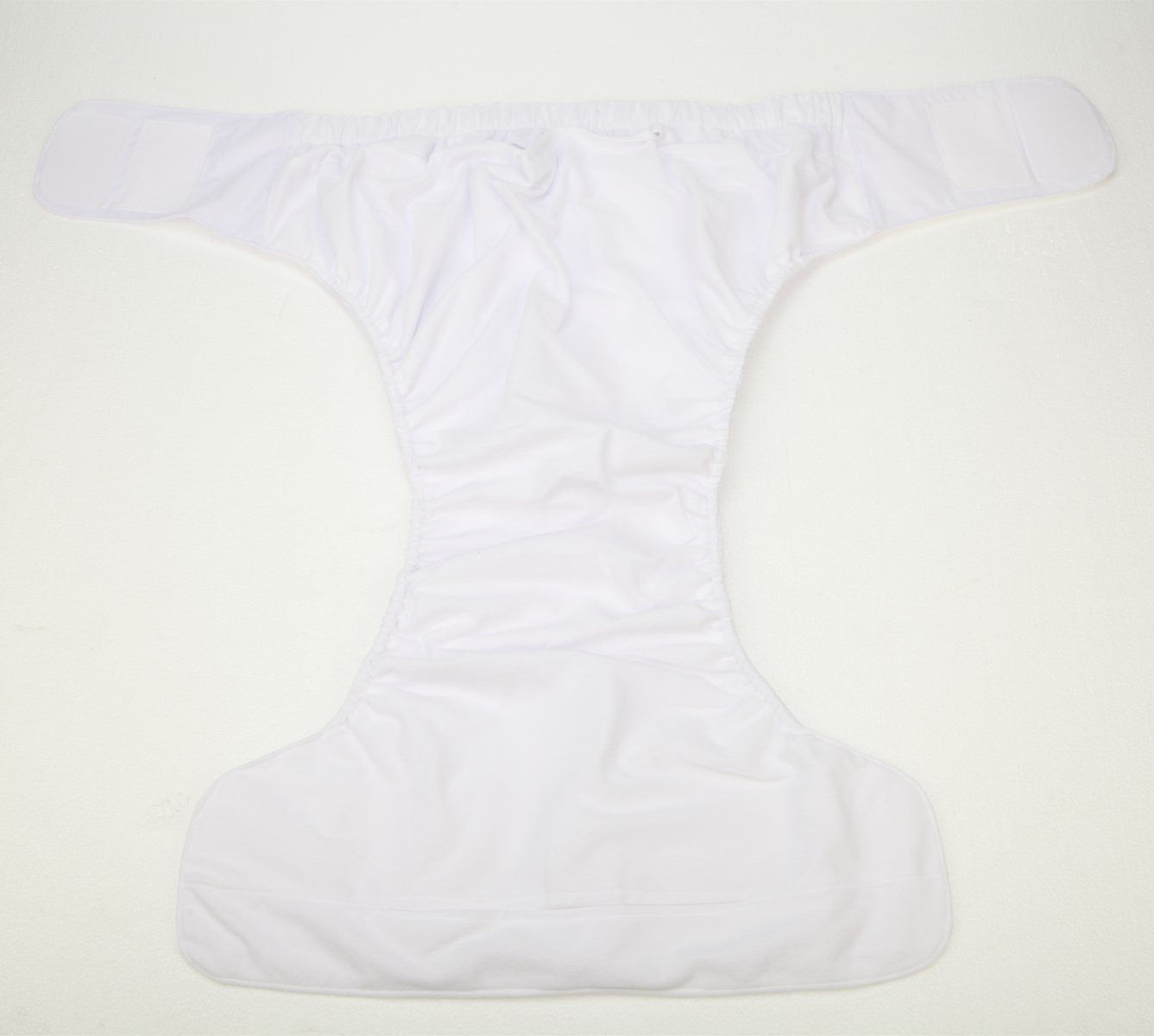 Sigzagor diaper with insert-compatible system and 4-layer microfiber core.
