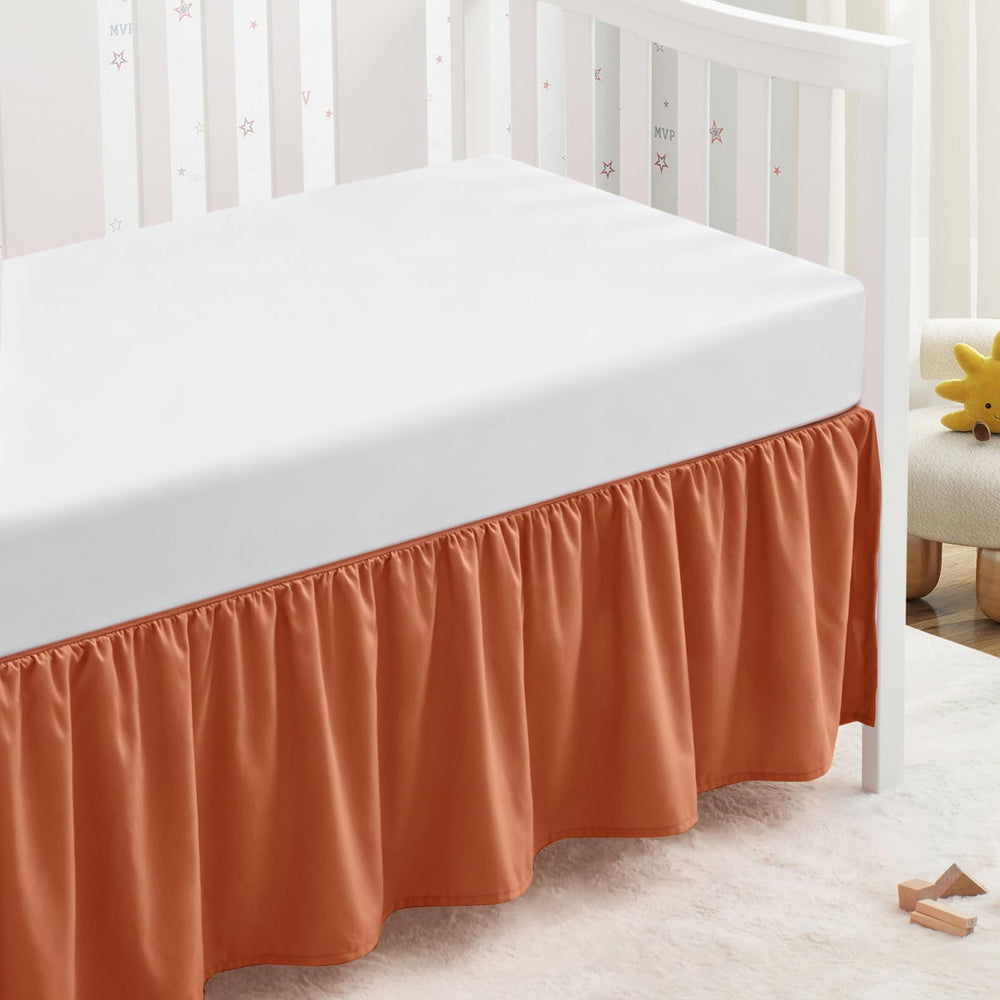SiinvdaBZX rust orange crib skirt with 14-inch drop keeps under-crib clutter hidden.