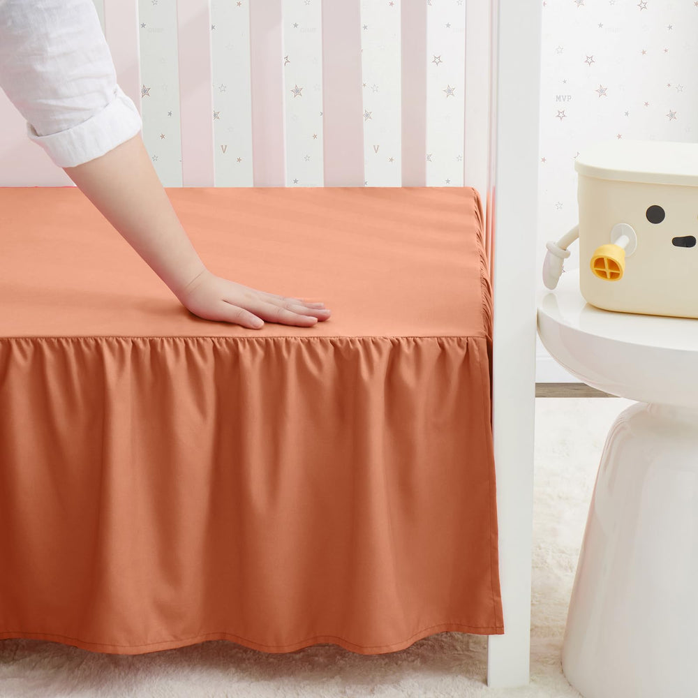 SiinvdaBZX rust orange crib skirt provides quick hiding of under-crib clutter.