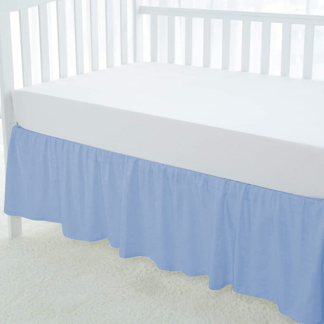 Silentnight crib skirt with 14-inch drop fits standard cribs and hides under-bed storage.