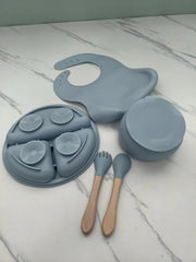 SiliBaby silicone spoon hugs baby gums for gentle feeding.