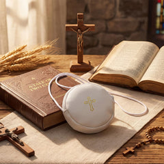 SilTriangle Pyx burse featuring a golden cross detail on white leather.