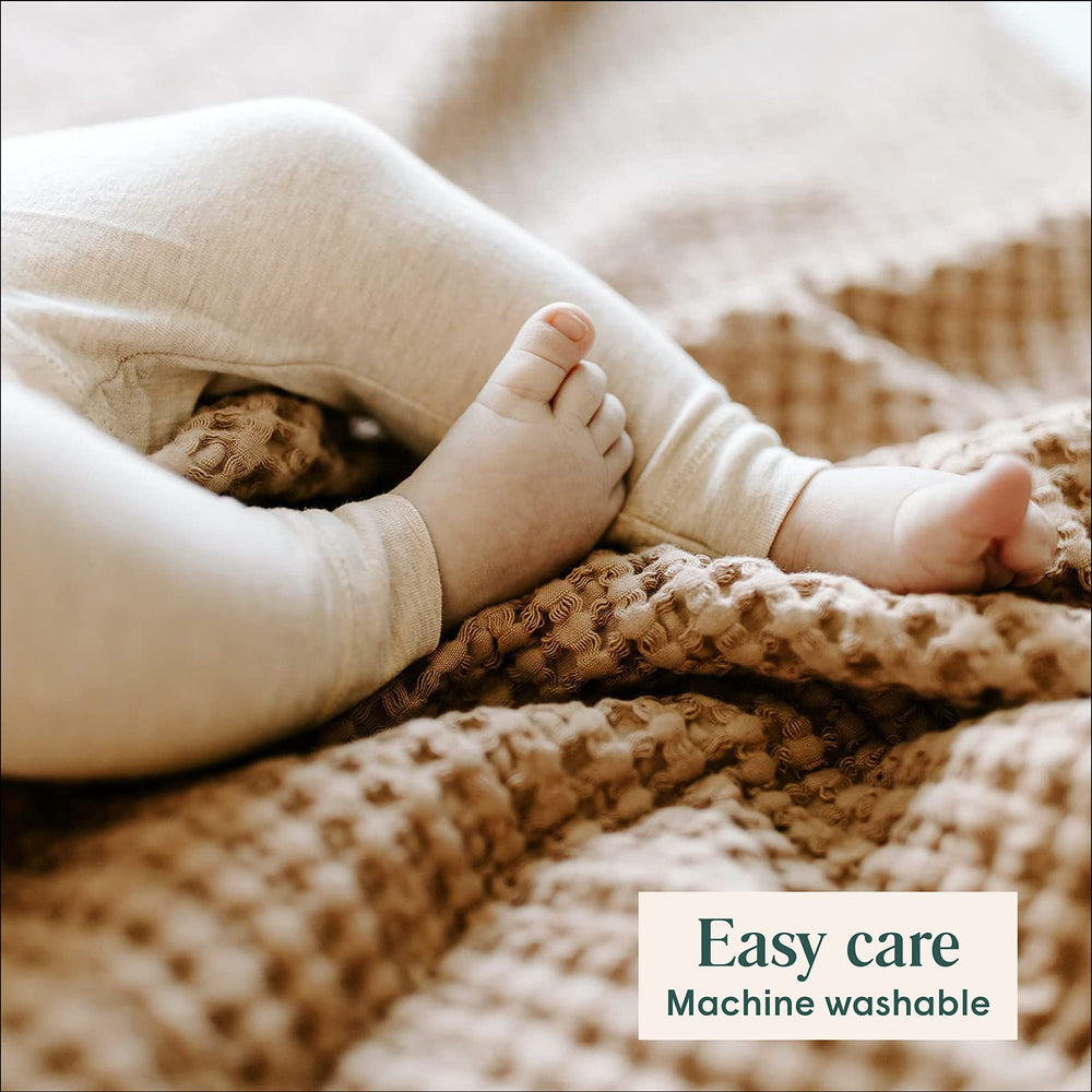 Simka Rose blanket shown on a stroller for outings