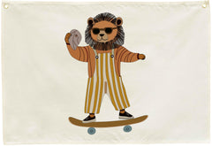 Sioial Lion Skateboarding Nursery Banner on beige canvas adds cozy charm to kids' spaces.