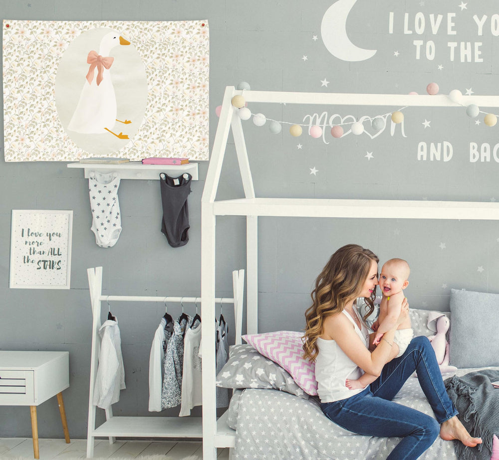Sioial Silly Goose beige banner flag above a bed adds subtle texture.