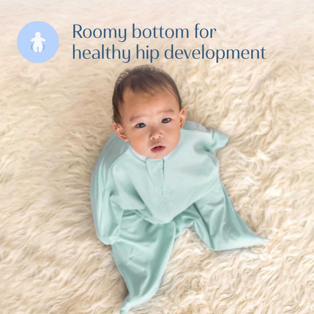 SleepingBaby Zipadee-Zip mint swaddle in use for safe overnight wear.