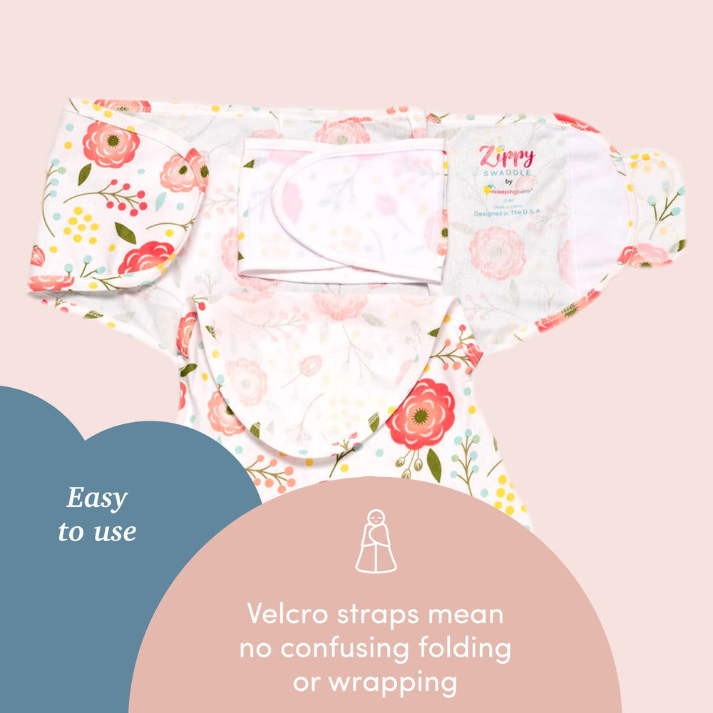 Baby wearing SleepingBaby Zippy Swaddle Pink Poppy demonstrating leg movement room