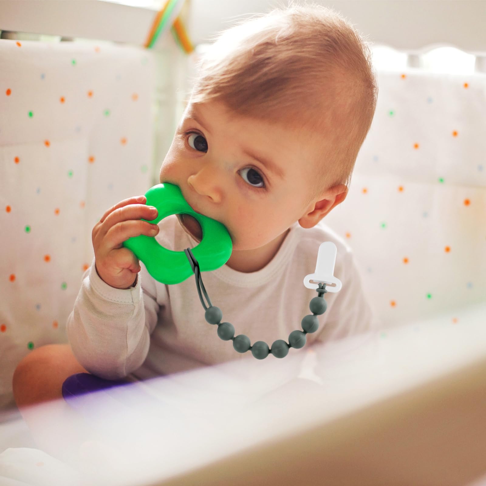Colorful silicone beads offering tactile stimulation during teething.
