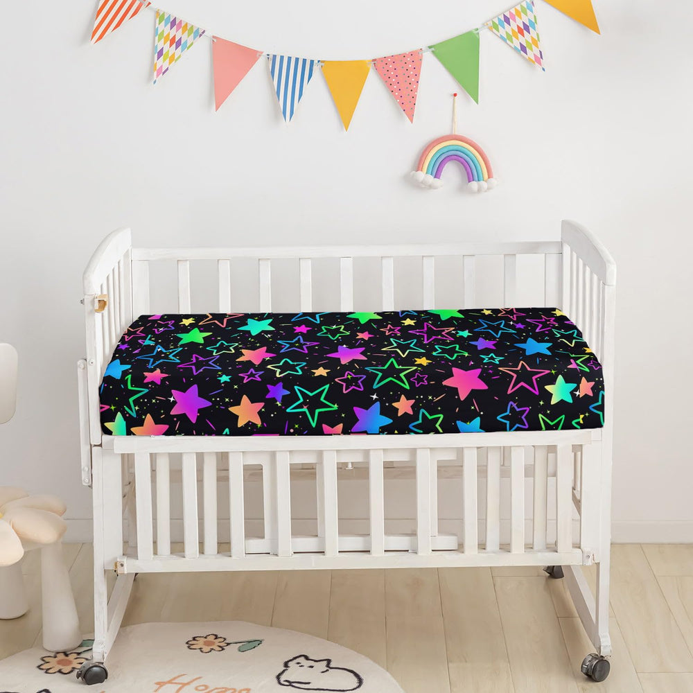 Smell Sunshine crib skirt coordinates with colorful gradient stars for a cohesive look.
