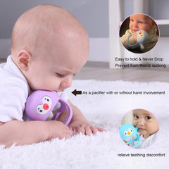 Smily Mia penguin teether in baby hand shows secure grip
