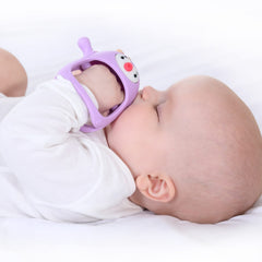 Smily Mia Penguin Teether closeup shows soft silicone texture for chewing safety.