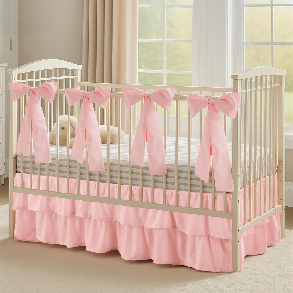 SmoothNovelty Pink crib skirt with bows enhances nursery decor and secure accents