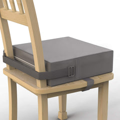 SMZCTYI Toddler Booster Seat on a grey chair offers stable, comfortable dining support