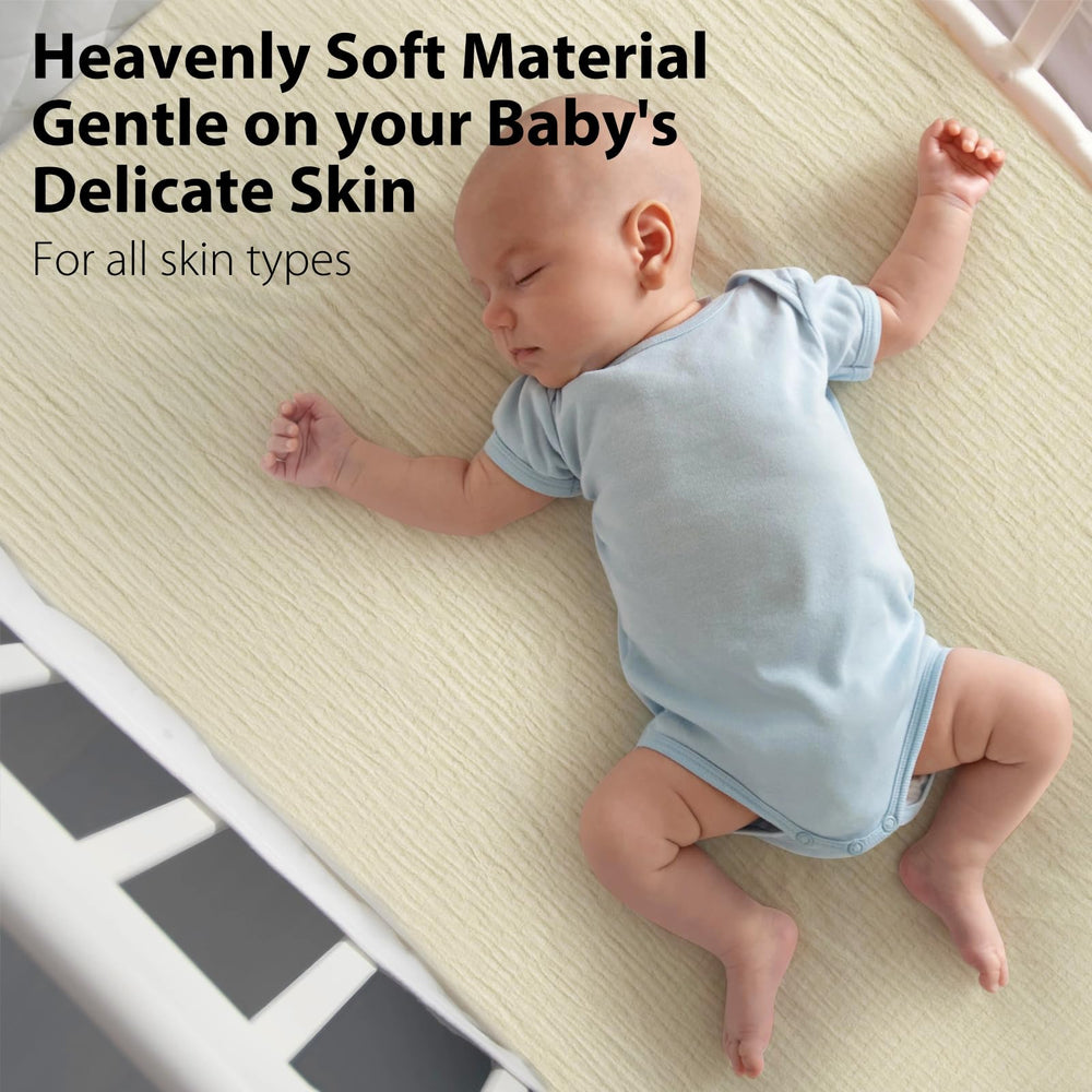 SNOOZYNEST crib sheet on a standard mattress showing proper fit.
