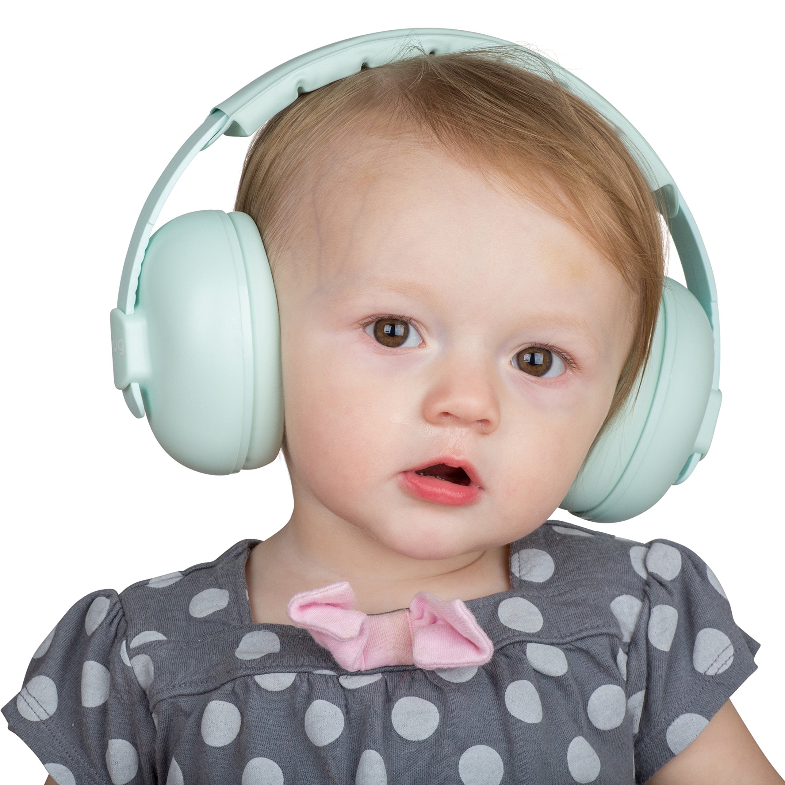Baby wearing Snug Earmuffs helps soothe and protect sleep during noisy nights.