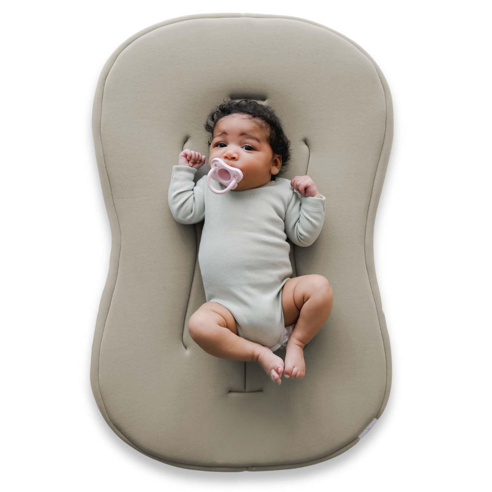 Snuggle Me Lounger Curve cover closeup, buttery-soft organic cotton for gentle newborn comfort.