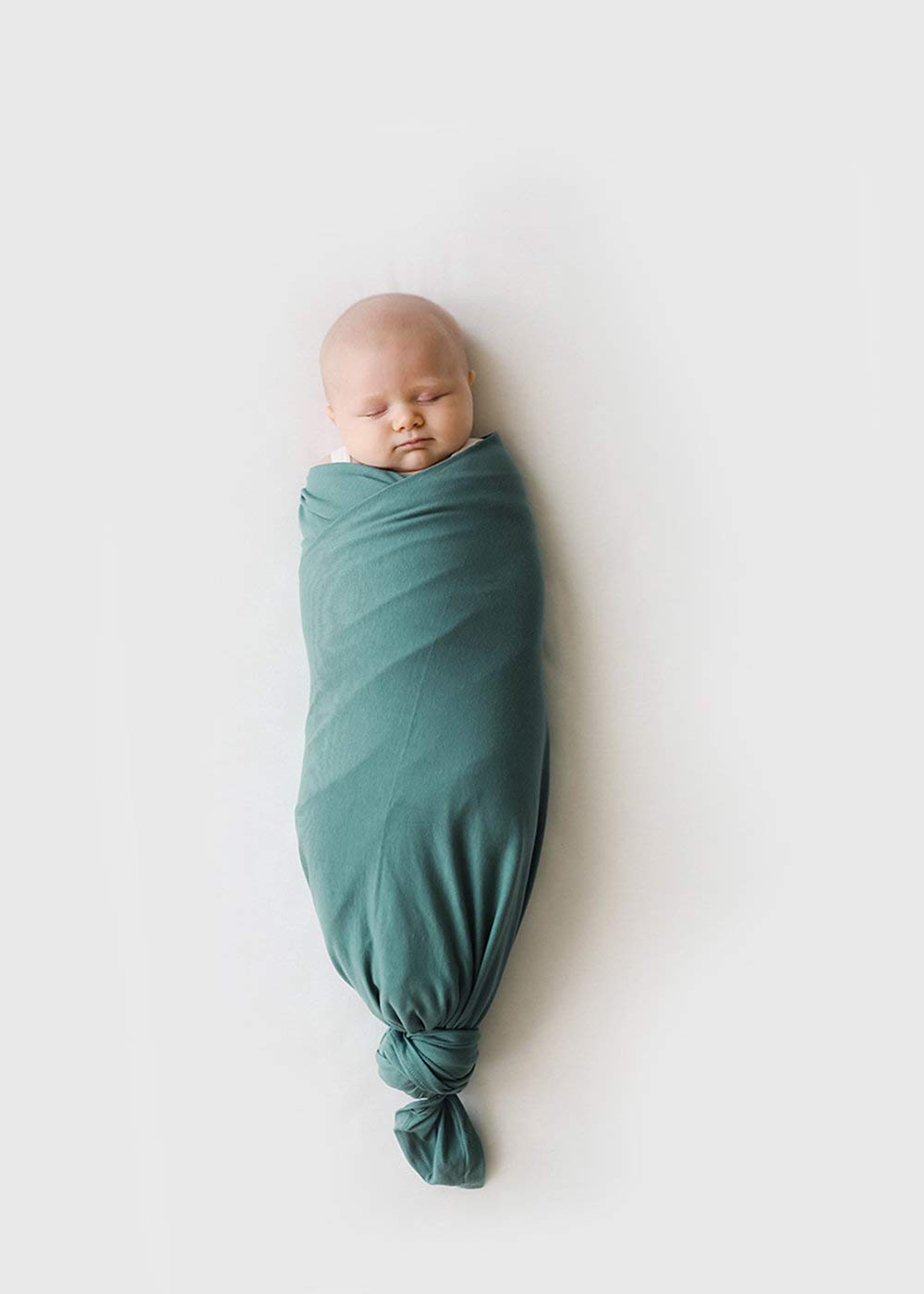 Snuggle Me Swaddle stretchy fabric demo emphasizes freedom of movement.