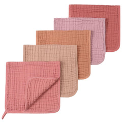 SnugOre 5 pack burp cloths showing soft muslin on newborn shoulders for gentle protection