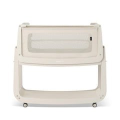 SnuzPod 5 bedside bassinet shown beside a bed for convenient nighttime proximity.