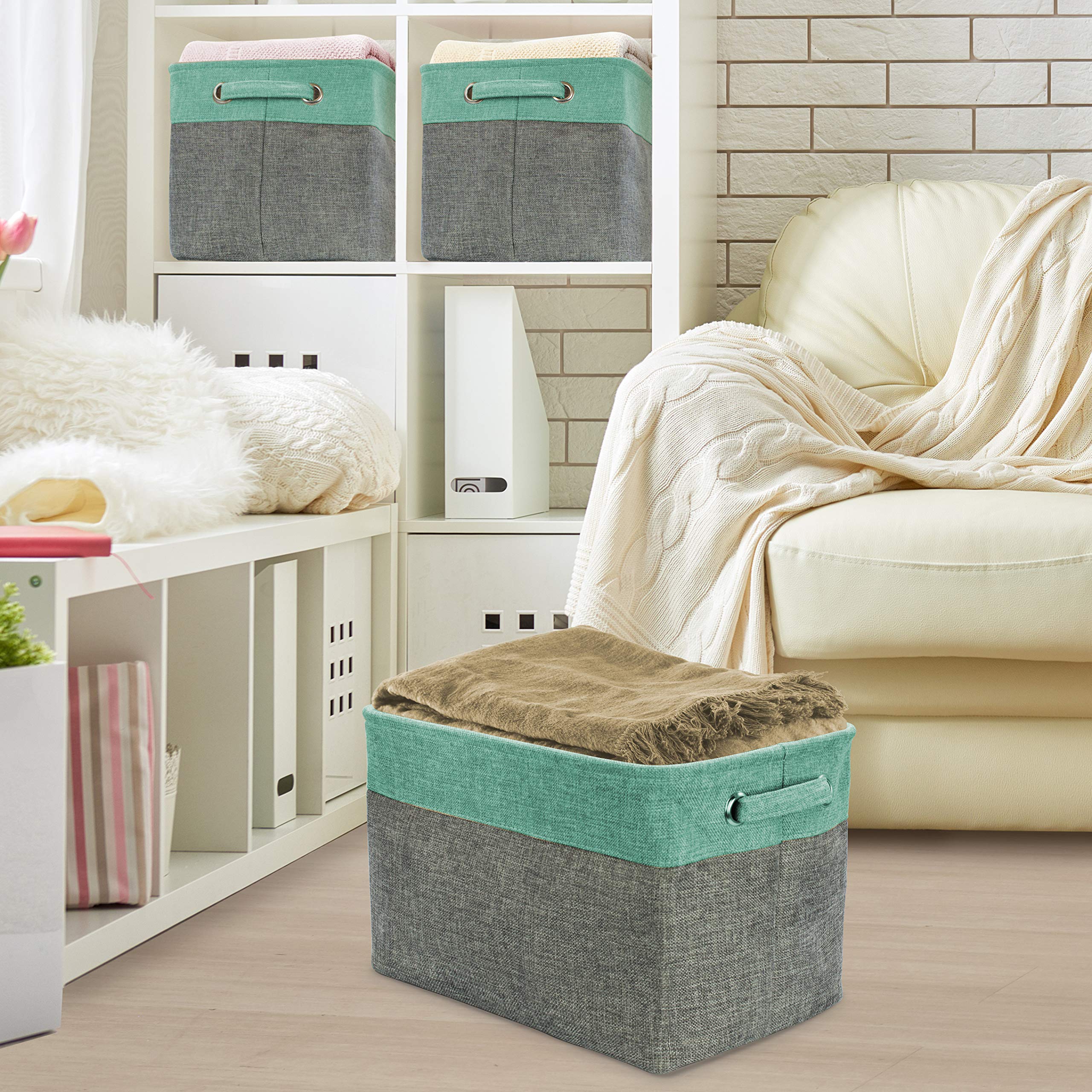 Bedroom storage with Sorbus teal linen interior cubes for magazines and linens.