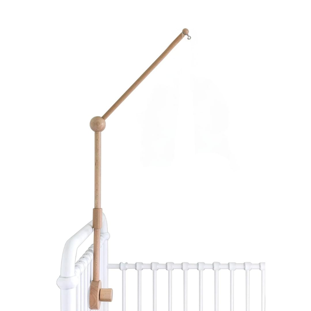 Sorrel + Fern baby crib mobile arm in natural beechwood securely holds a mobile.