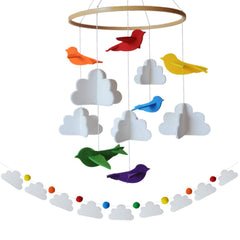 Sorrel + Fern baby mobile with rainbow birds in clouds offering calming nursery decor