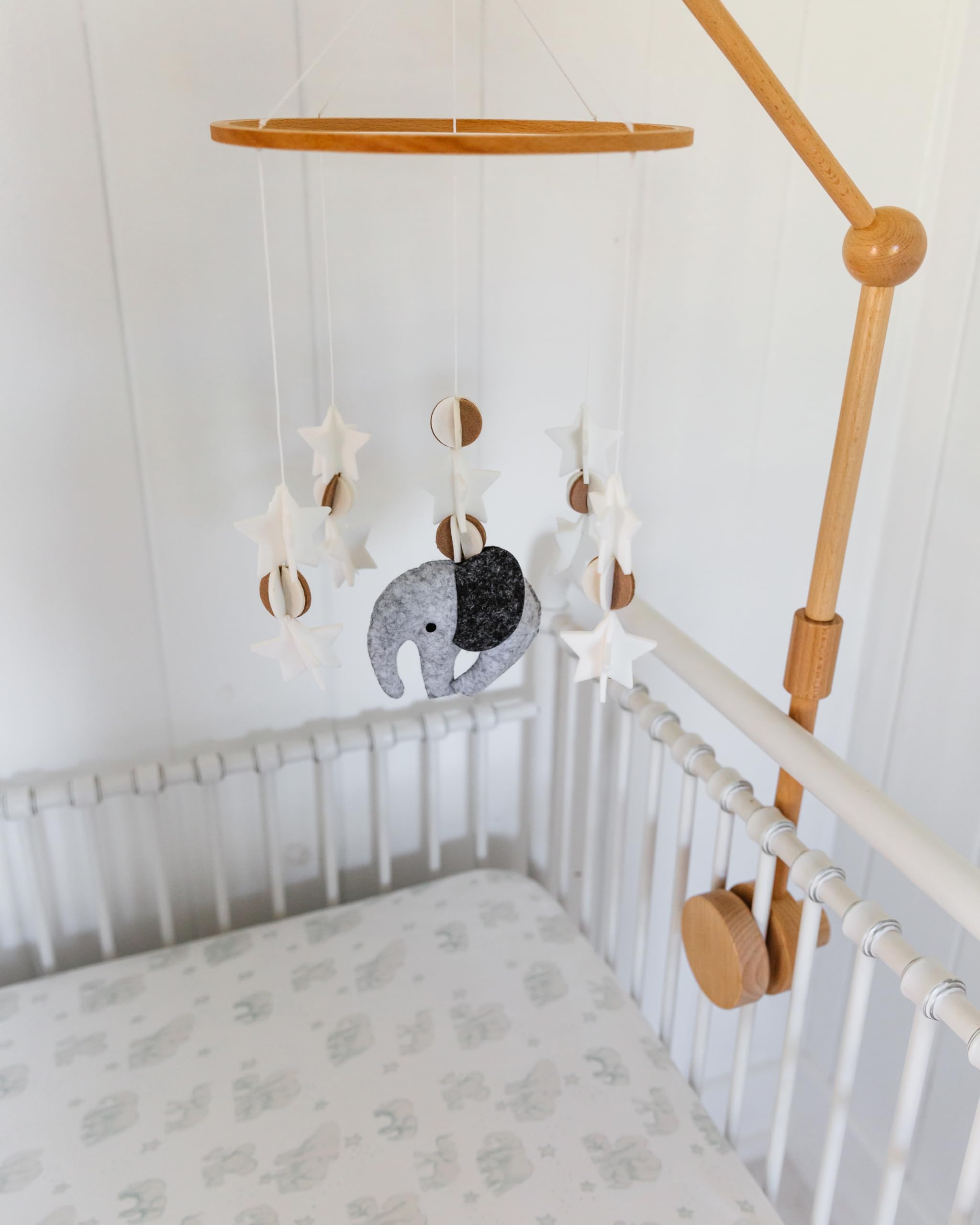 Sorrel + Fern bassinet-compatible wooden mobile with elephant motifs.