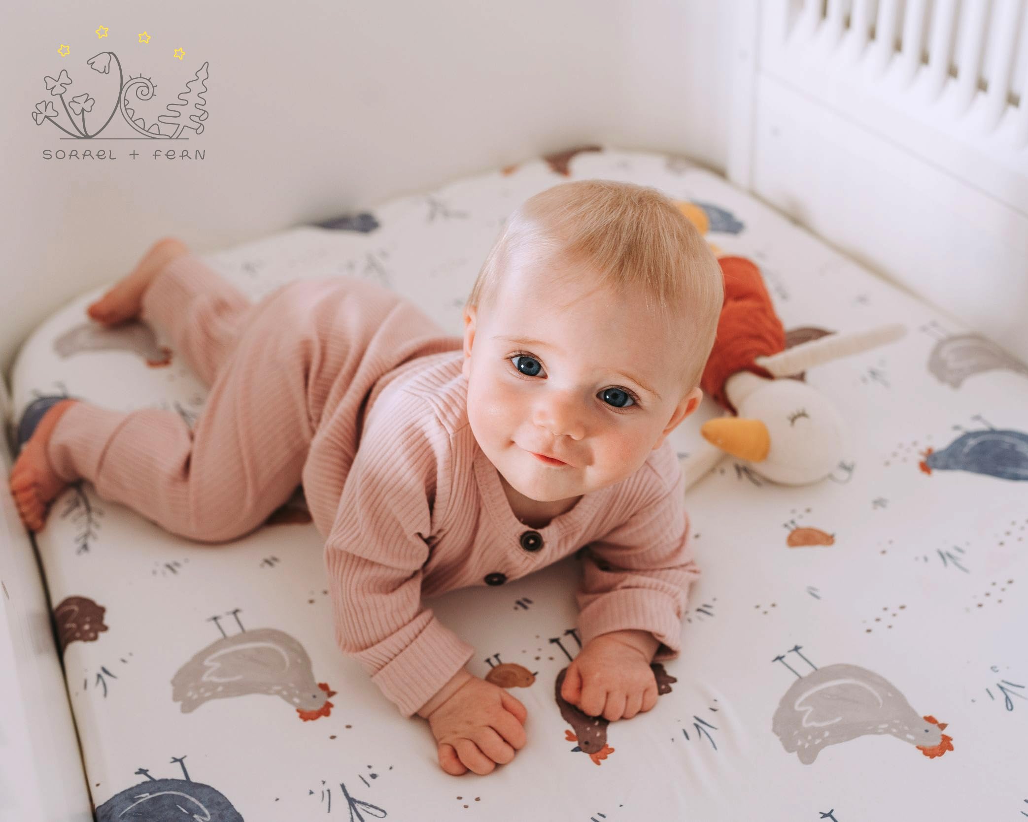 Sorrel + Fern bassinet sheets with deep elastic pockets secure on the mattress