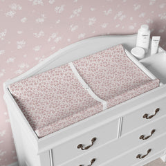 Sorrel + Fern changing pad cover on changing pad demonstrating deep pockets prevent slipping