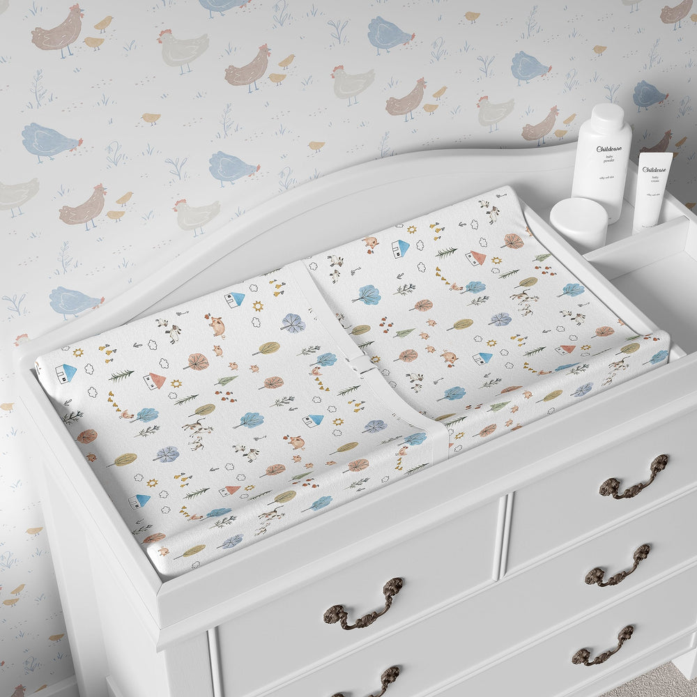 Sorrel + Fern farm animals pattern changing pad cover stays bright after washes.